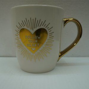 Coffee mug Follow your heart Gold colored handle and lettering